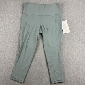 Athleta Salutation Stash Pocket II Leggings Womens Medium Petite Green 7/8 Yoga